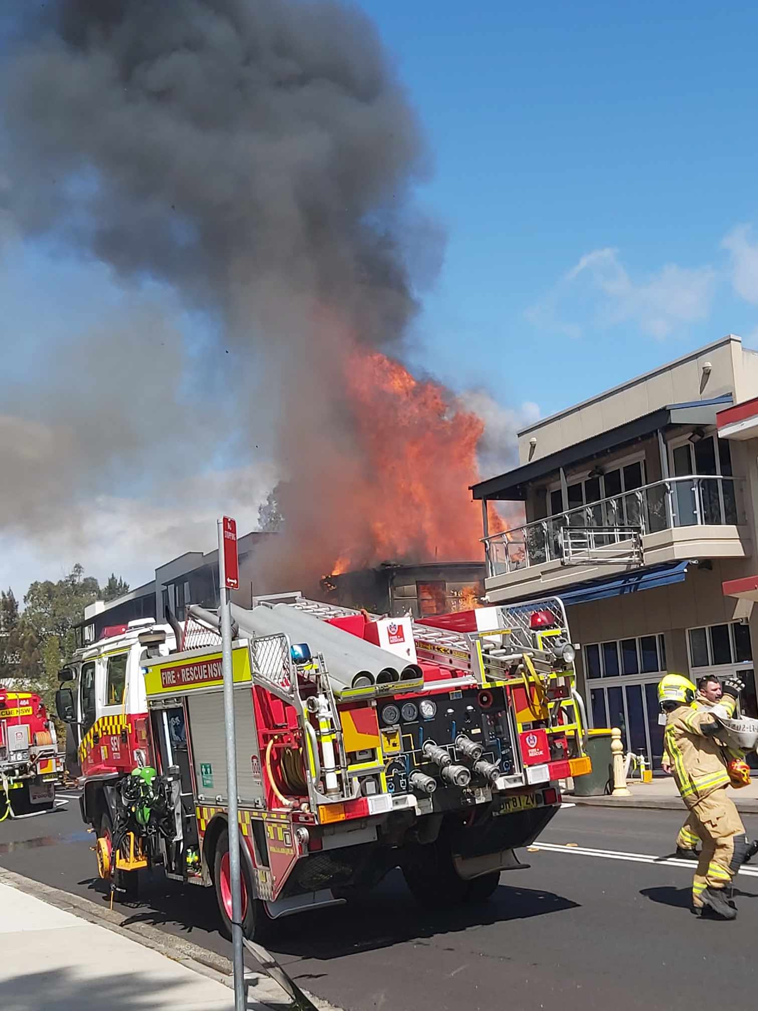 A Shop fire in Toronto NSW Australia on 15/9/2024. This shows a fire truck out the front with a burning building in the background.