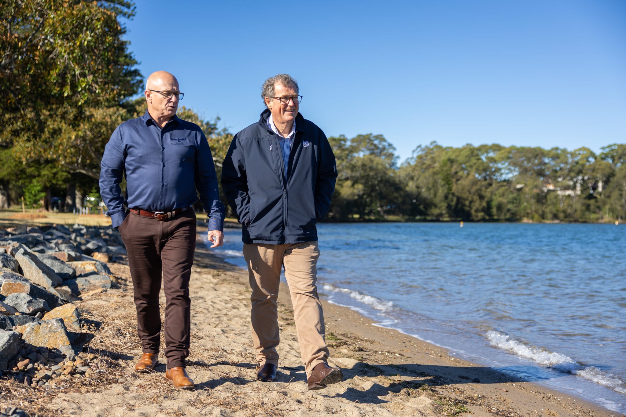 25697_Biraban LALC CEO Jamie Williams and LMCC Deputy CEO David Hughes walk along the rehabilitated foreshore