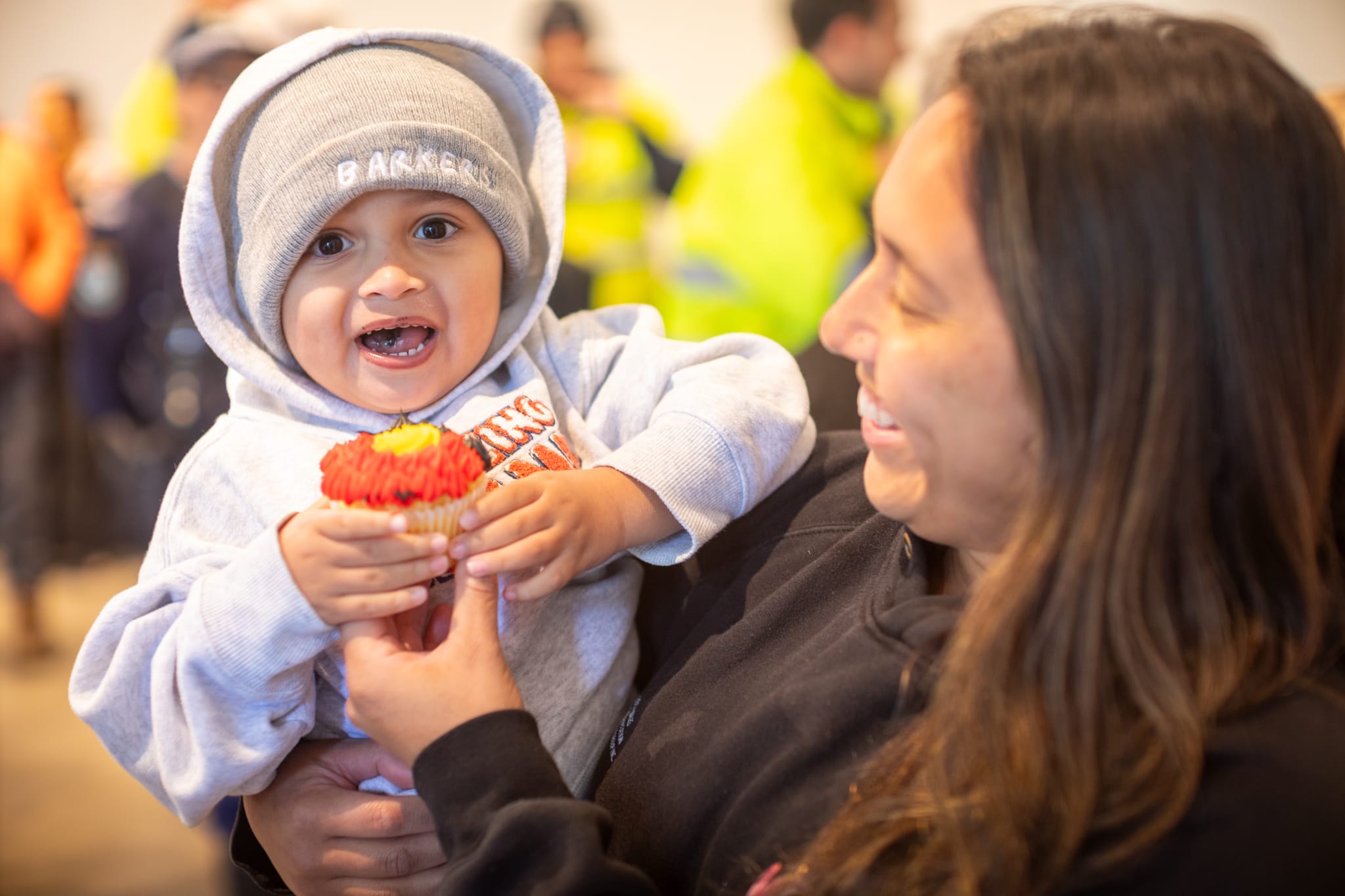 28186_Ngarlu Barker enjoys a cupcake at the event with his mum, Leticia Quinlan
