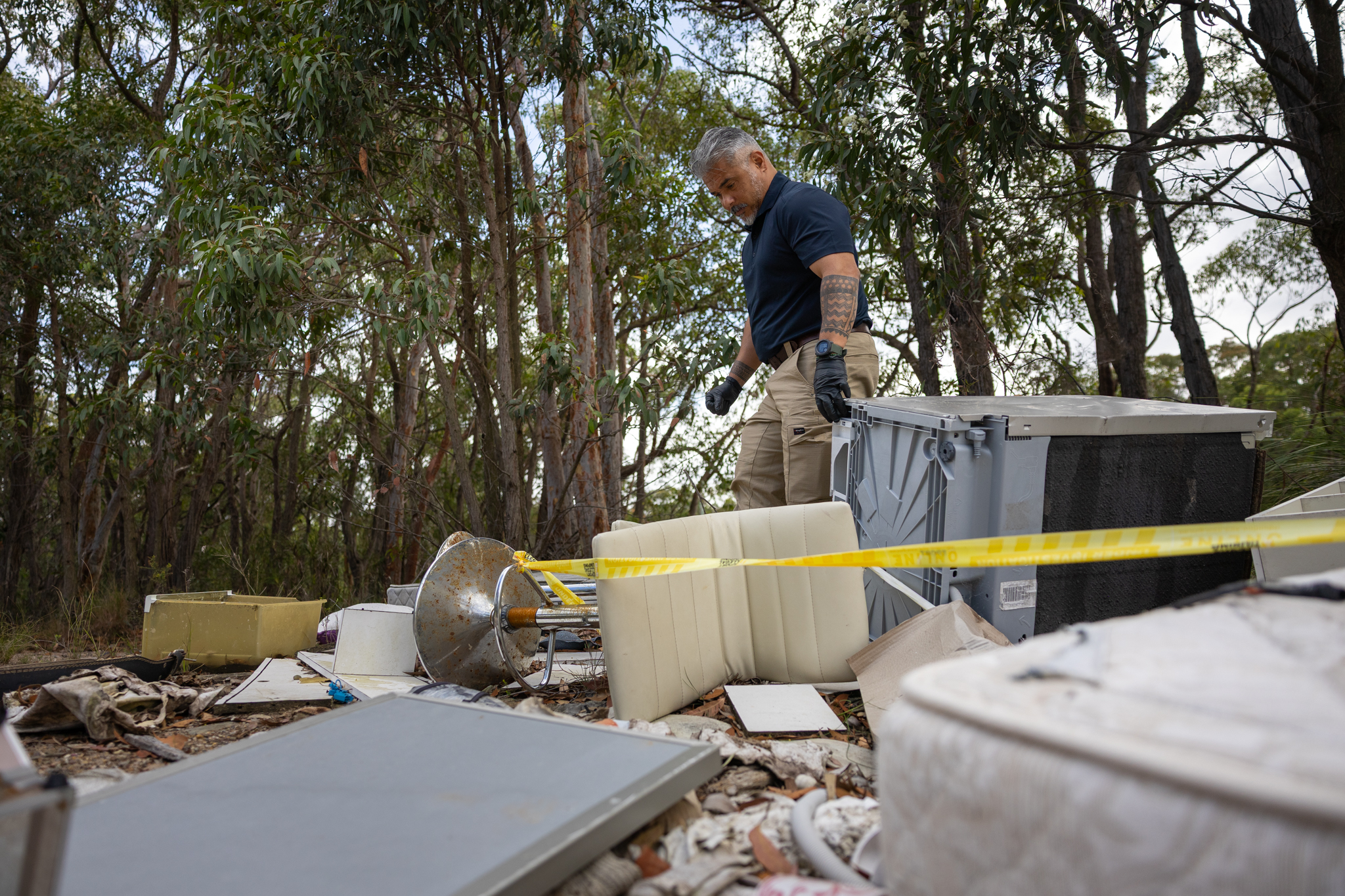 33284_Compliance Officer Angelo Cosgayan at a dump site near Wangi Wangi
